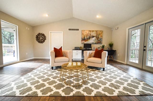 a living room with two chairs and a table