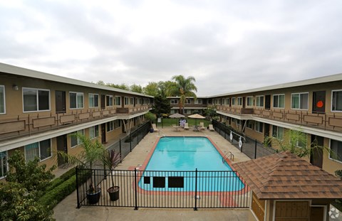 A pool in the middle of apartment buildings.
