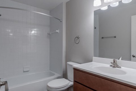 a bathroom with a sink toilet and a shower