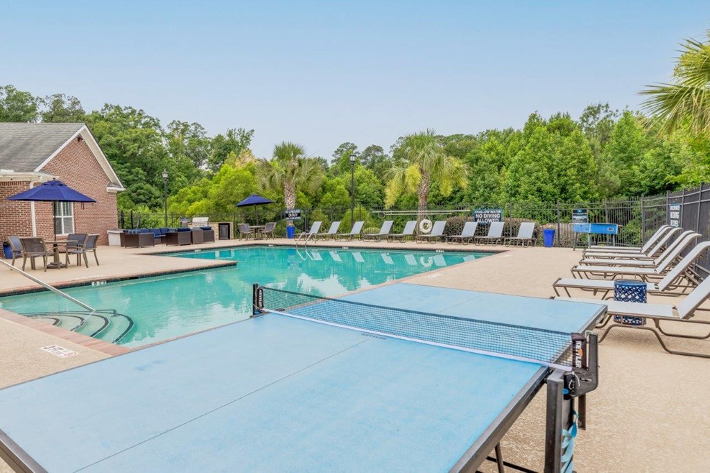 the swimming pool at our apartments has a ping pong table