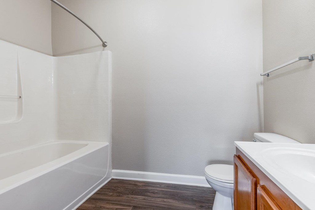 a bathroom with a sink toilet and a bath tub