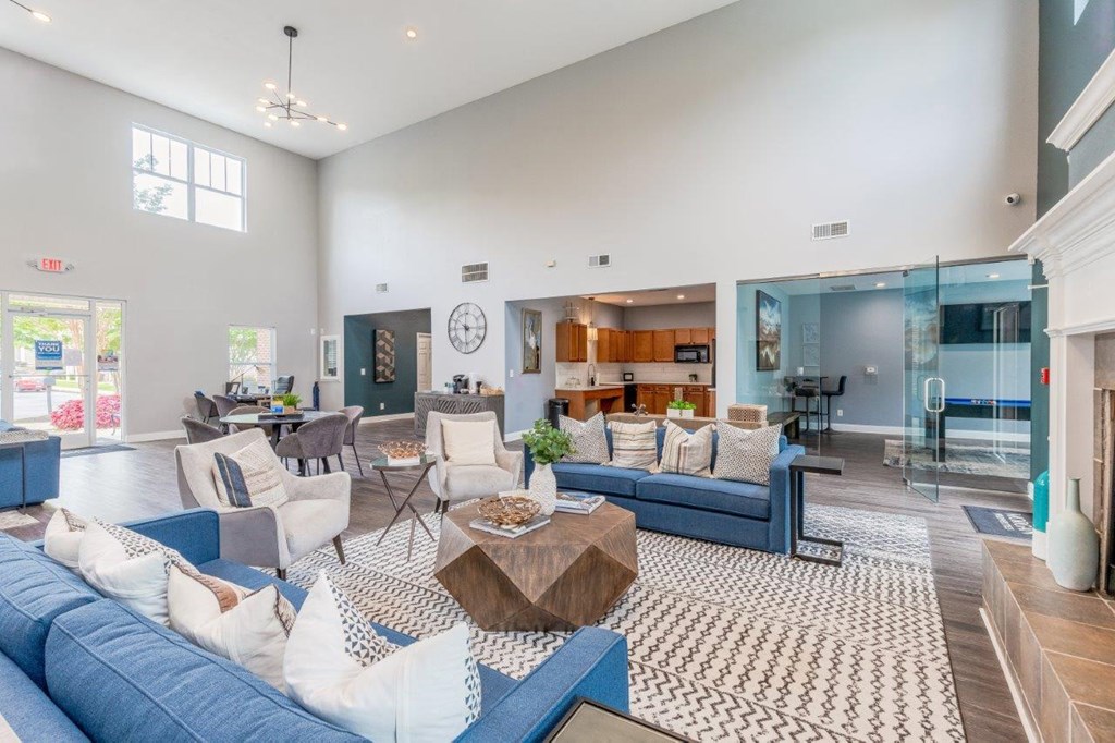 a living room with blue couches and a coffee table