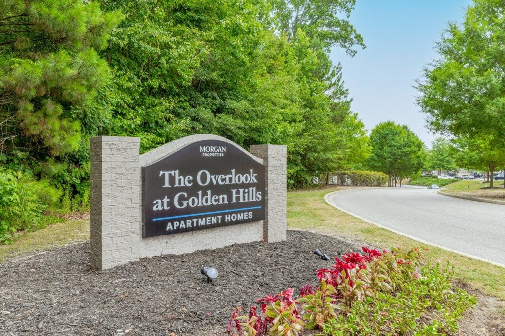 the overlook at golden hills sign at the entrance to the park