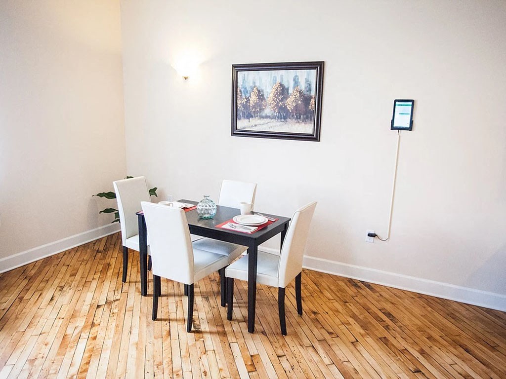 a dining room with a table and chairs