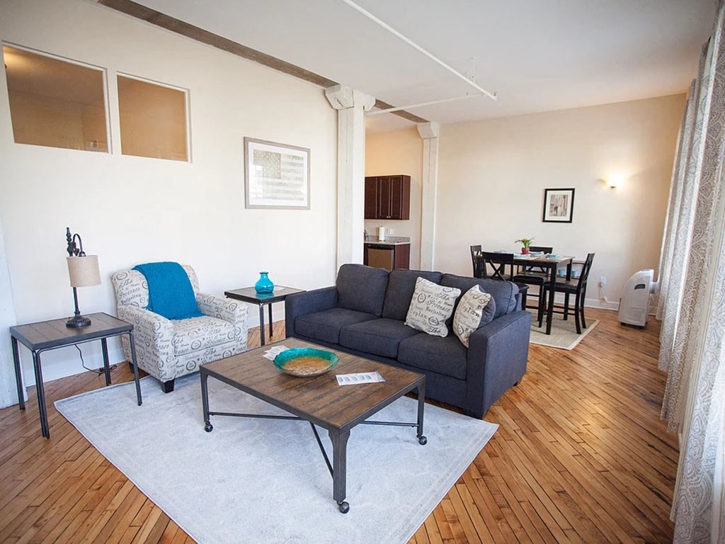 a living room with a couch and a table