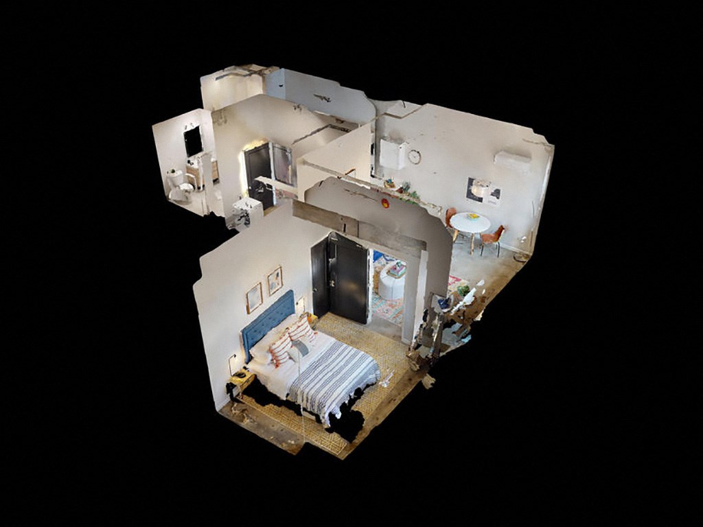 a model of a room with a bed and a bathroom