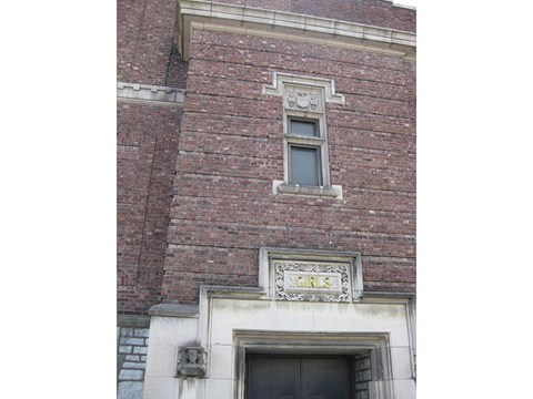 a window on the side of a brick building