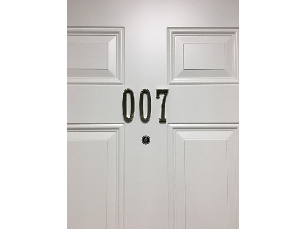 a white door with the number 007 on it