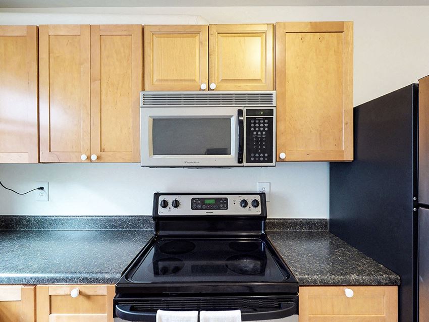 a kitchen with a stove and a microwave