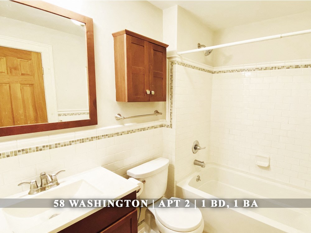 an image of a bathroom with a sink toilet and tub