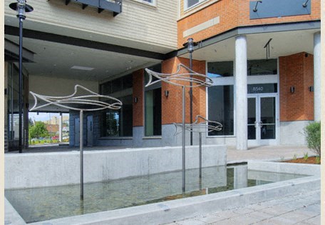 a building with a water fountain in front of it