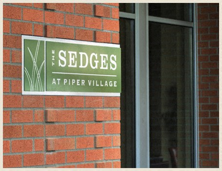 a sign on the side of a brick building