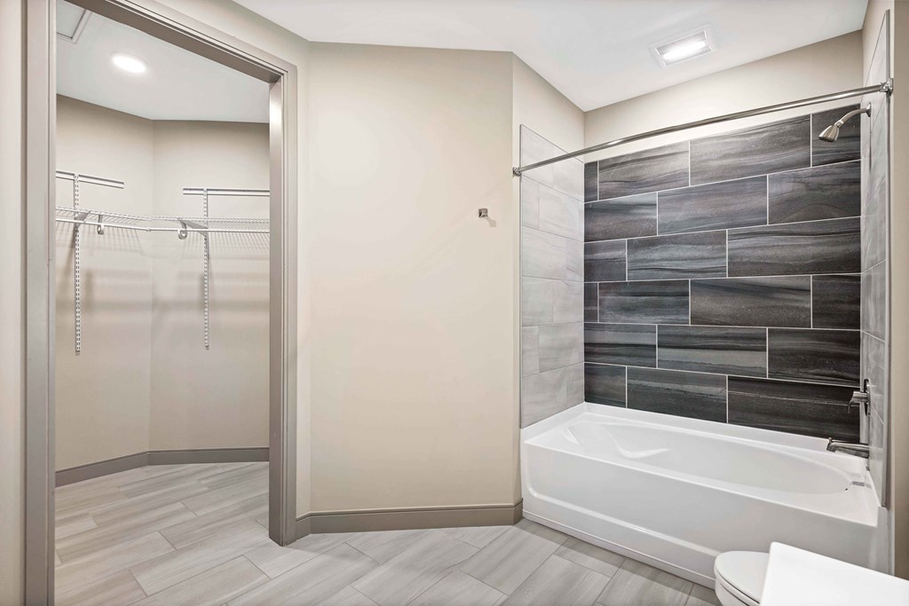 Upton Oxmoor Apartments Louisville primary bathroom and walk-in closet