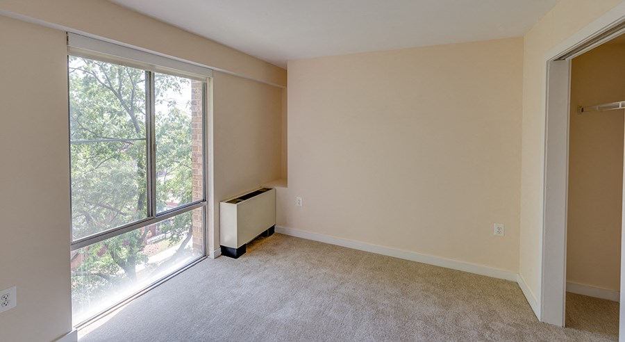 living space carpeted with window