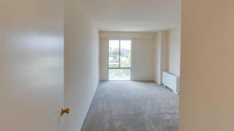 living space carpeted with window