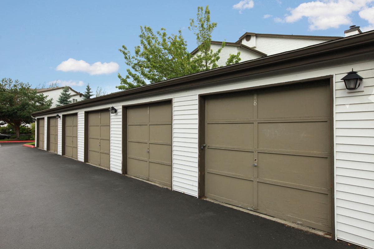 a row of garage doors on the side of a building