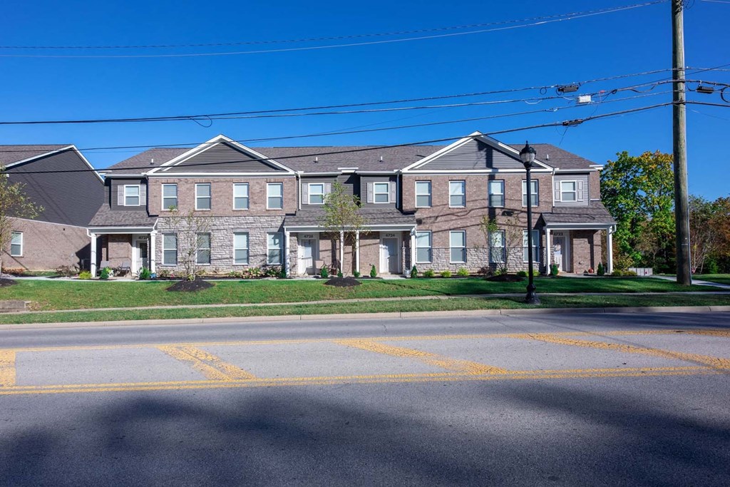 an apartment building on the corner of a street