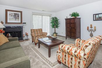 Living room area with couch at Cloverset Valley Apartments, Missouri, 64114