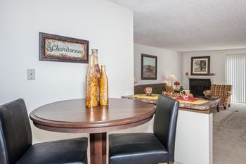 Wooden table and chairs at Cloverset Valley Apartments, Kansas City