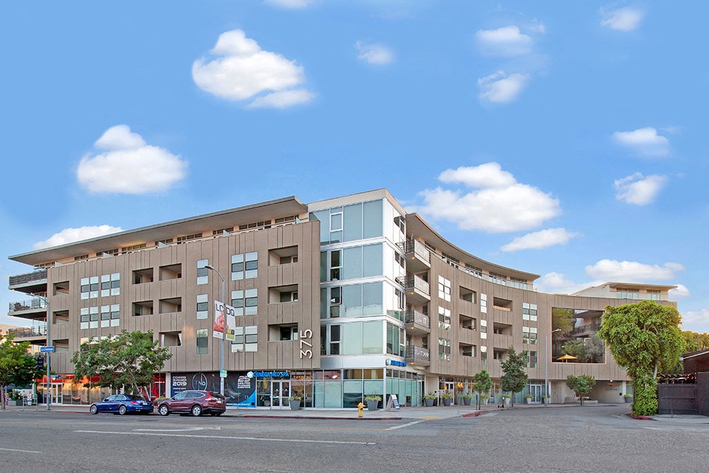 a large building on the corner of a city street