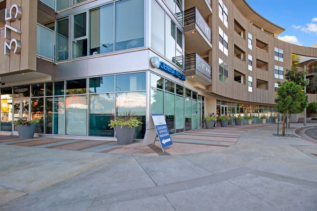 an office building with a sign in front of it