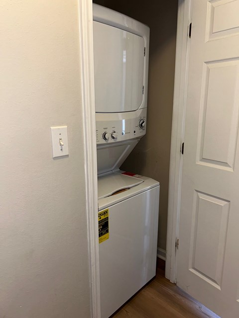 A white oven and dishwasher in a small kitchen.