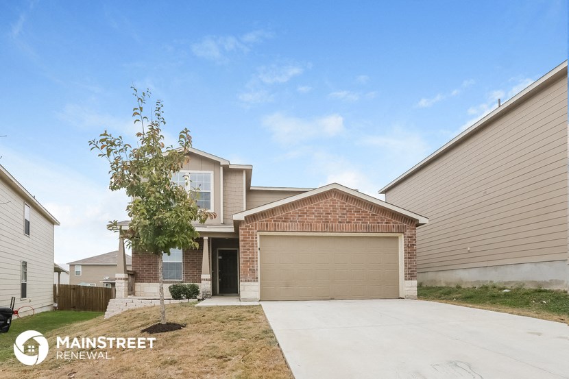 a house with a driveway and a garage door