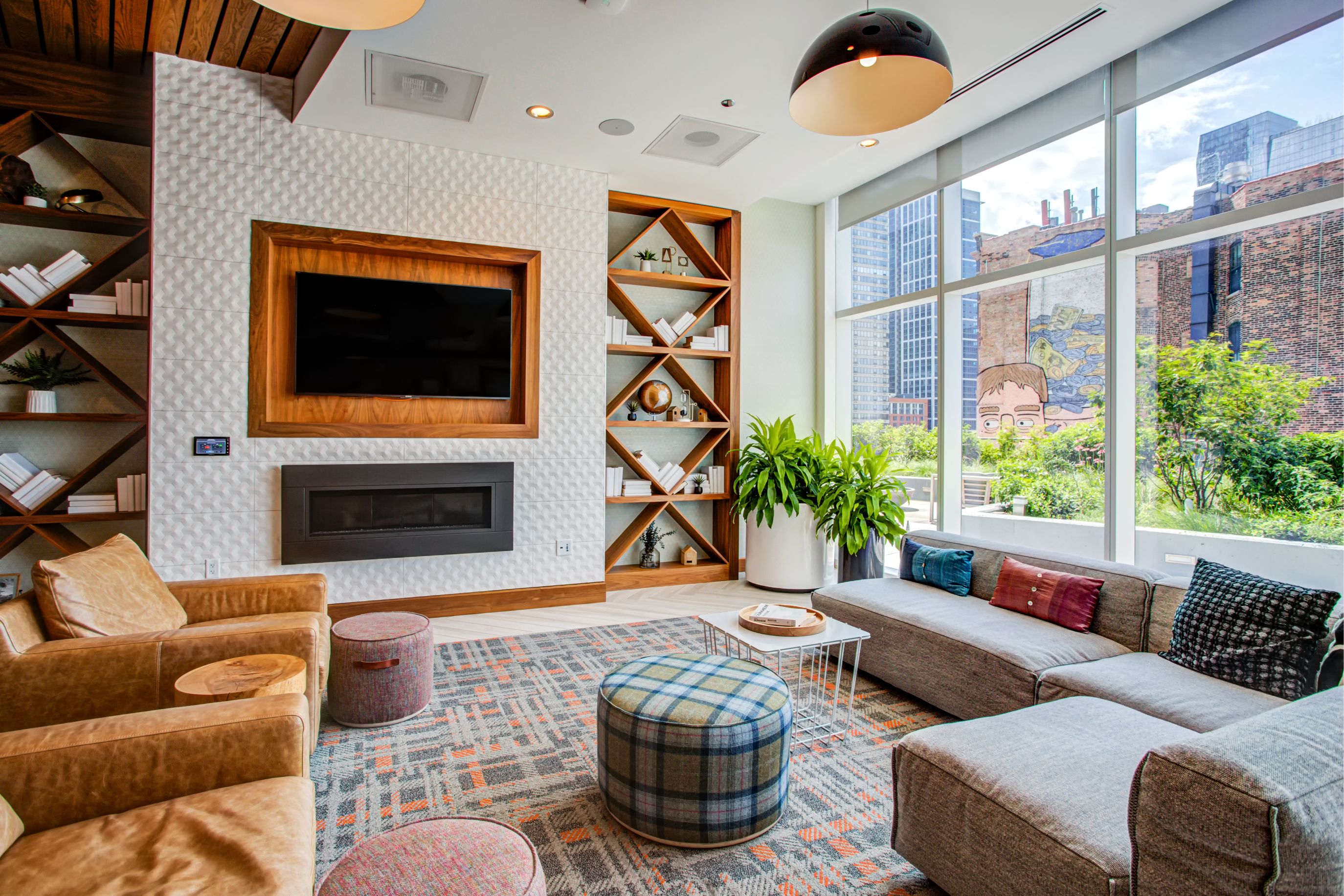 TV lounge with comfy chairs and couches at Eleven40, Chicago, IL, 60605