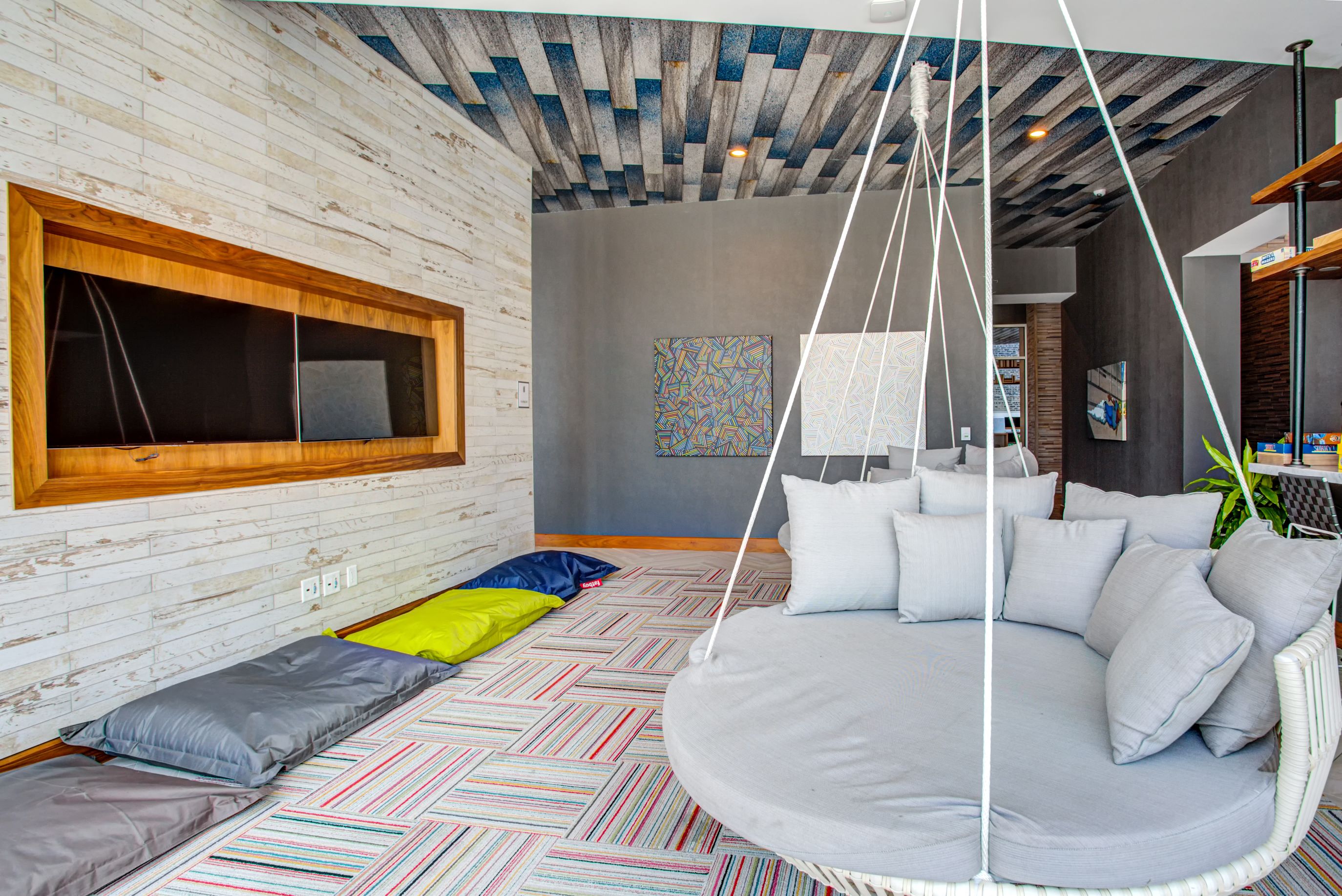 Relaxing lounge area with suspended lounger swings from the ceiling at Eleven40, Chicago, 60605