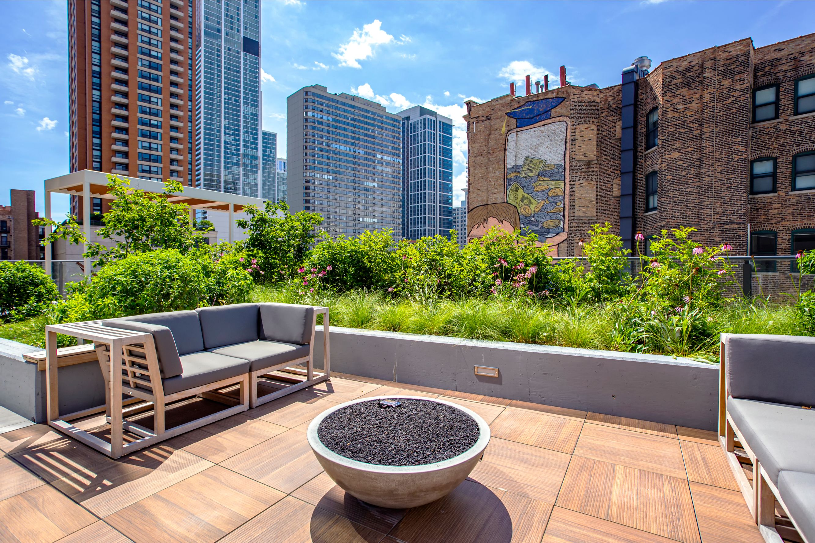 Outdoor deck with seating surrounding fire pit at Eleven40, Chicago