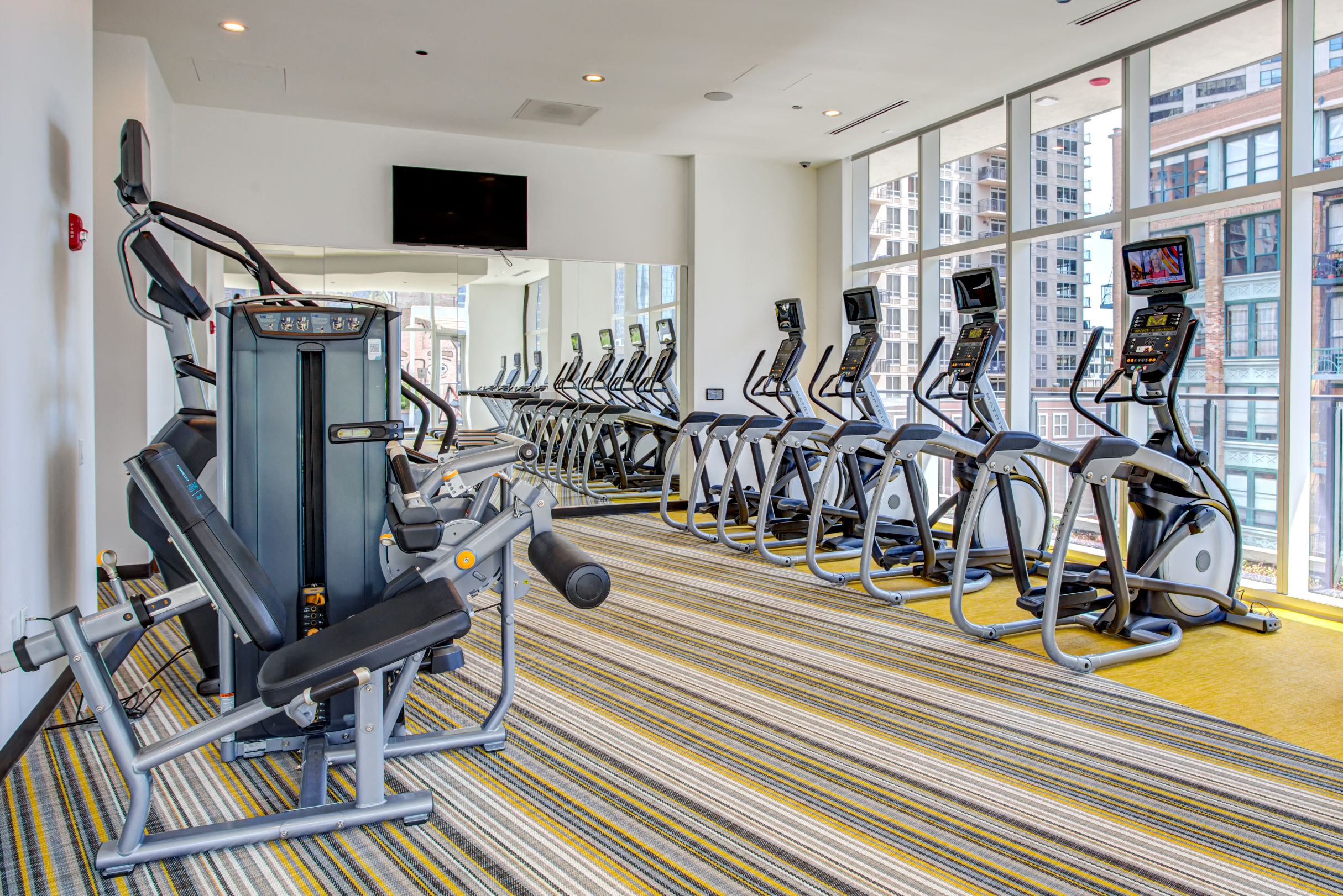 Fitness center with cardio and strength training equipment at Eleven40, Chicago, IL, 60605