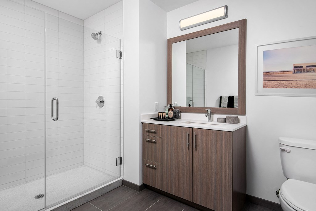 Modern upgraded bathroom with walk-in shower at Eleven40, Chicago, Illinois
