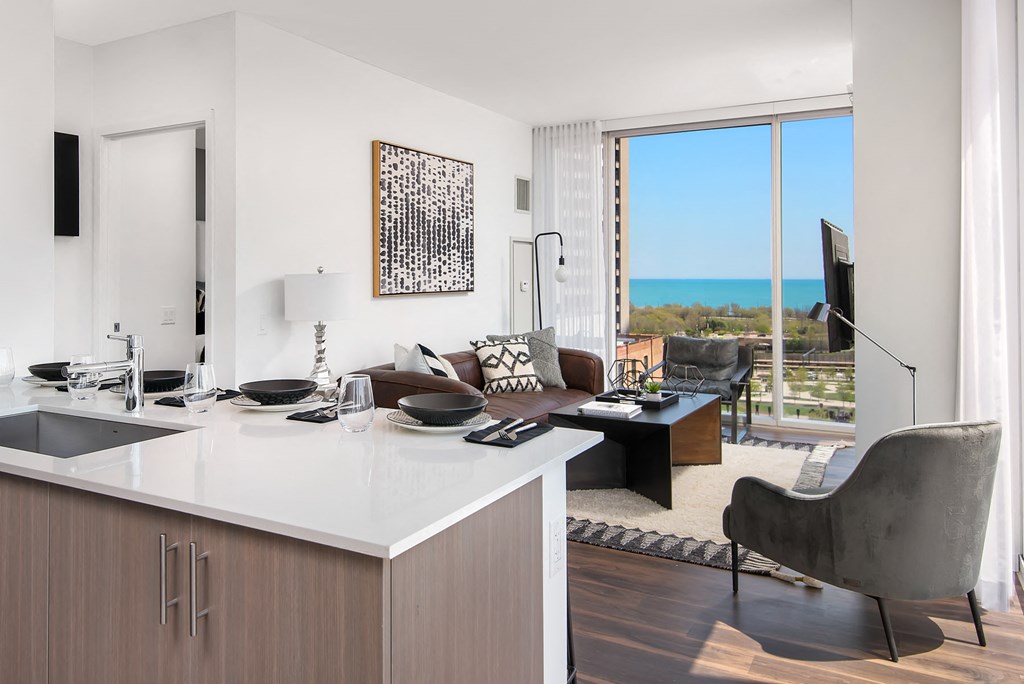 Two bedroom living room with open floor plan and floor to ceiling windows at Eleven40, Illinois, 60605