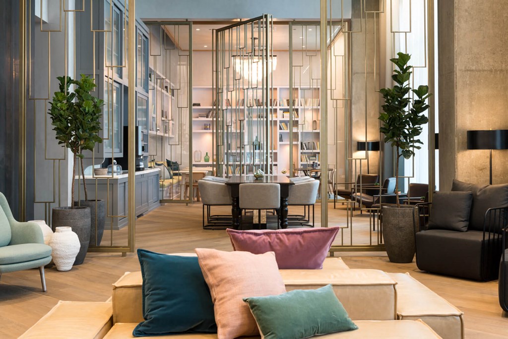 a living room with couches and chairs and a table