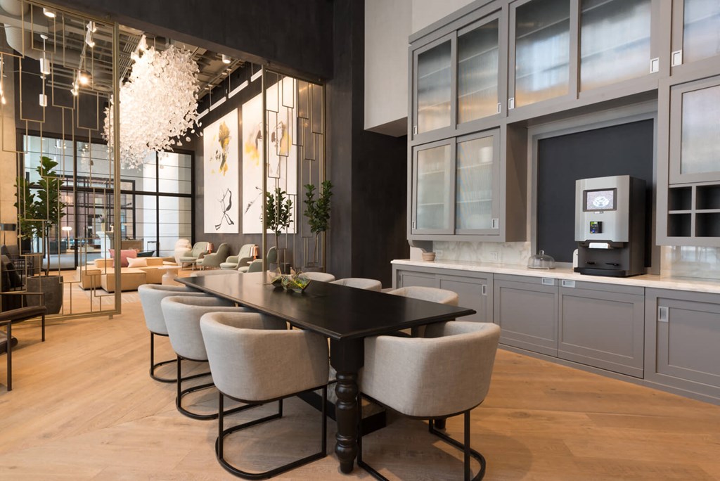 a dining room with a table and chairs