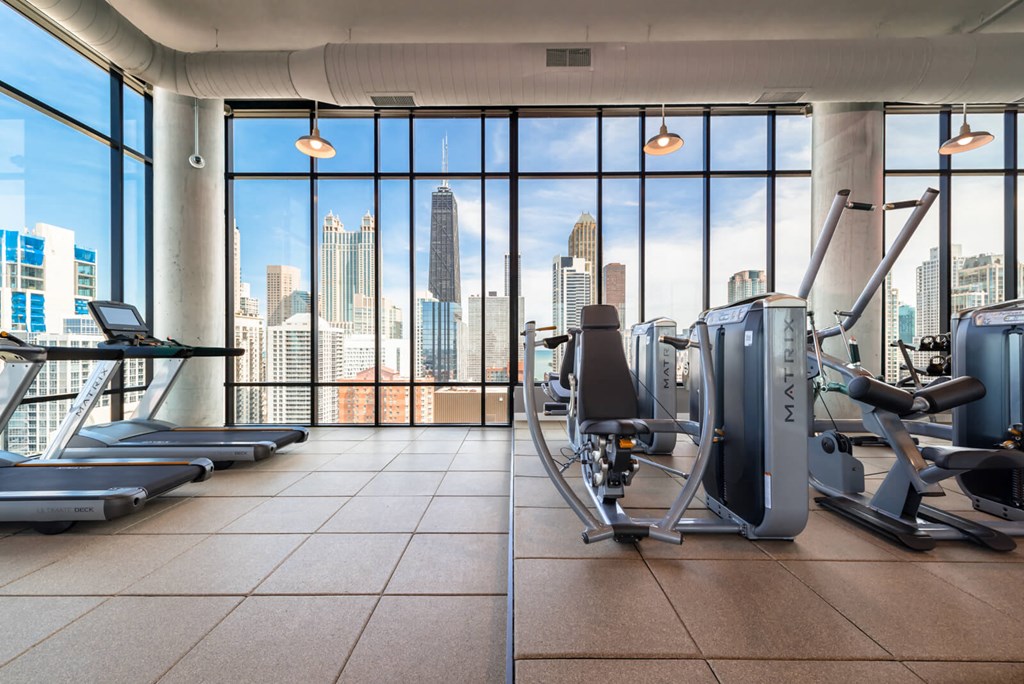 a gym with a view of the city