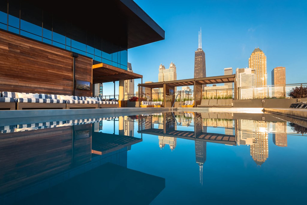 a view of the city skyline from the pool