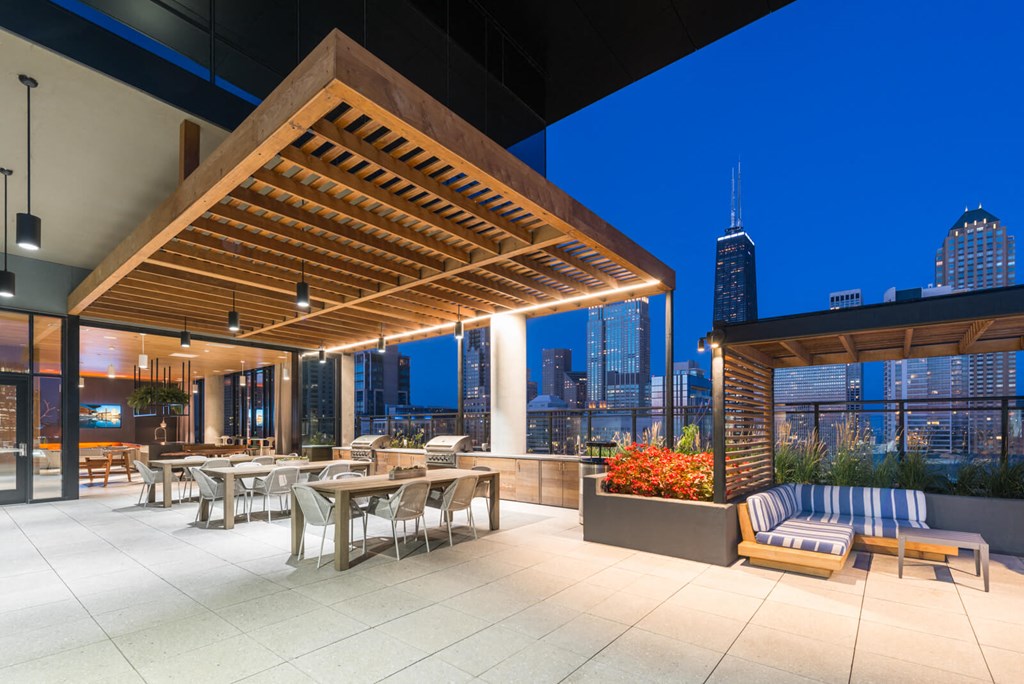 a rendering of a rooftop terrace with tables and chairs
