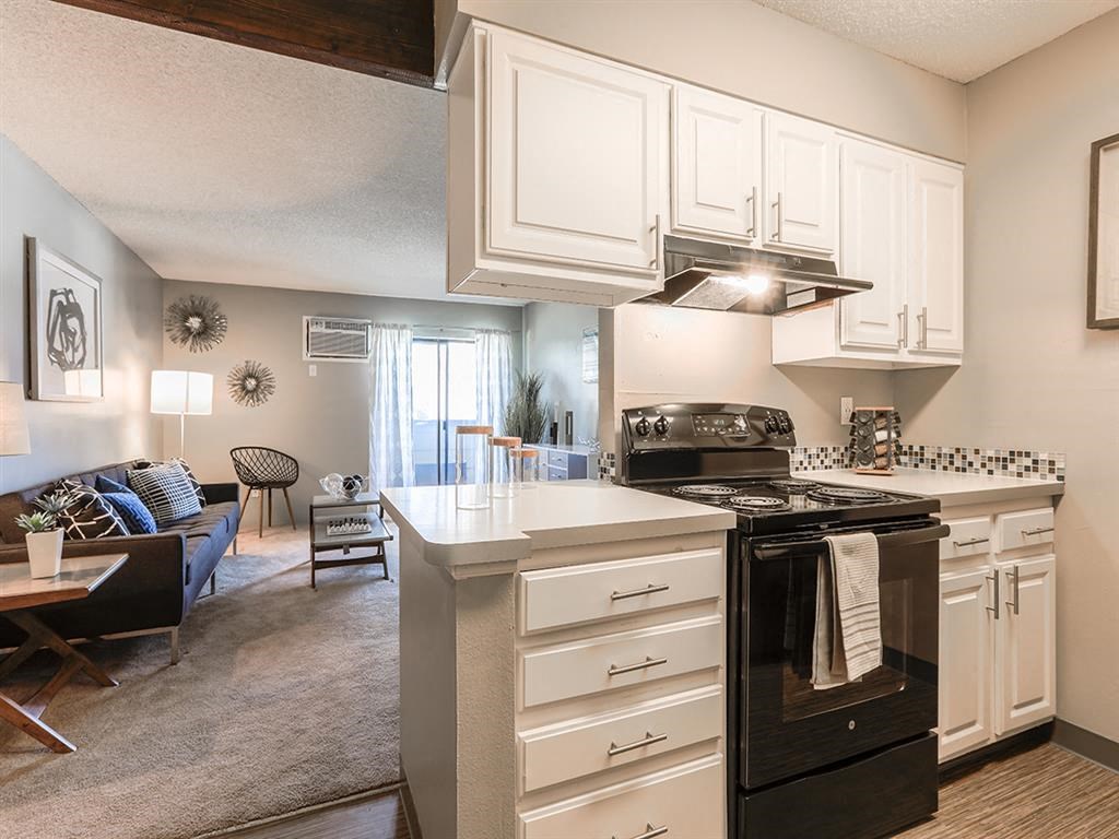 a kitchen with a stove and a microwave