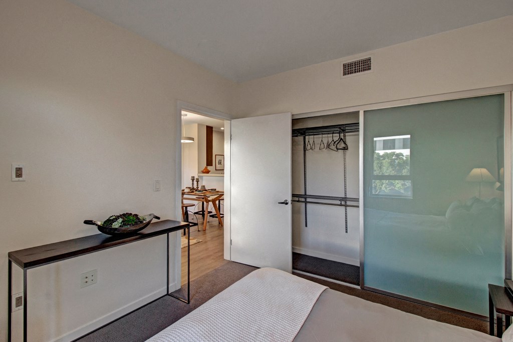 a living room with a sliding glass door to a bathroom