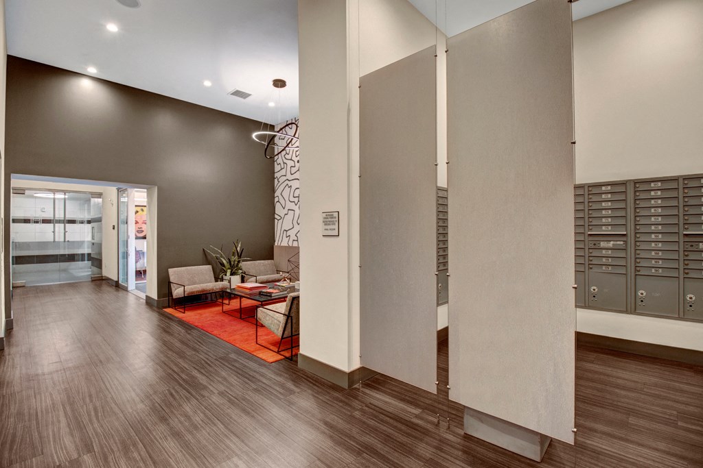 a renovated living room with gray walls and wood floors