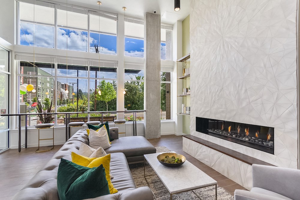 a living room with a couch and a fireplace