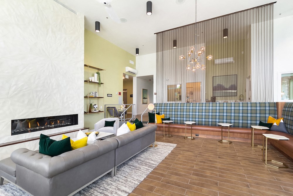 a living room with a couch and a fireplace