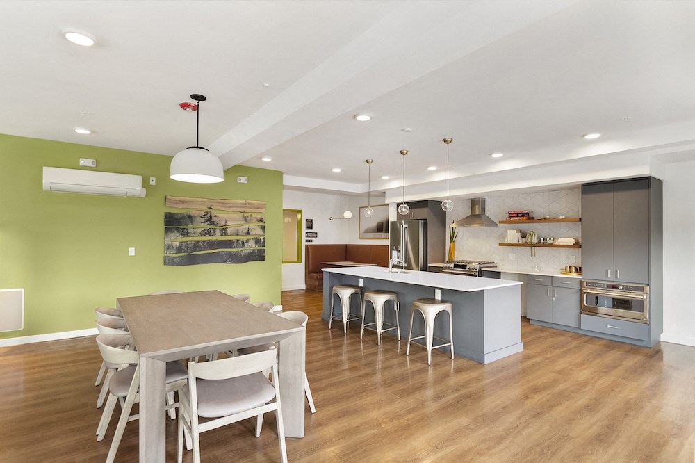 a kitchen and dining room with a table and chairs
