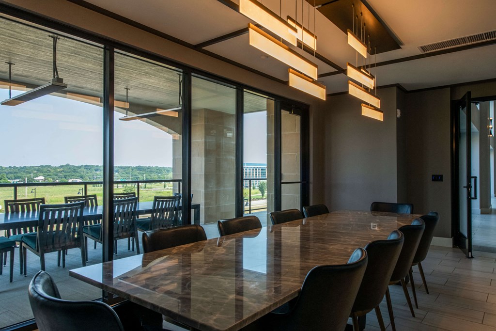 large conference room with large conference table and chairs looking over a patio at The Apex at CityPlace, Overland Park, KS