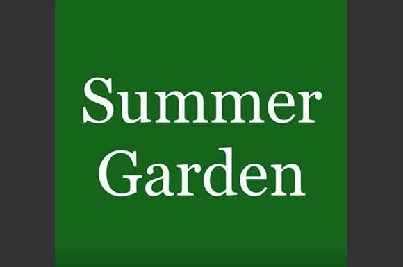 A green sign with the words "Summer Garden" written on it.
