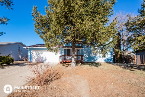 a house with a large tree in front of it