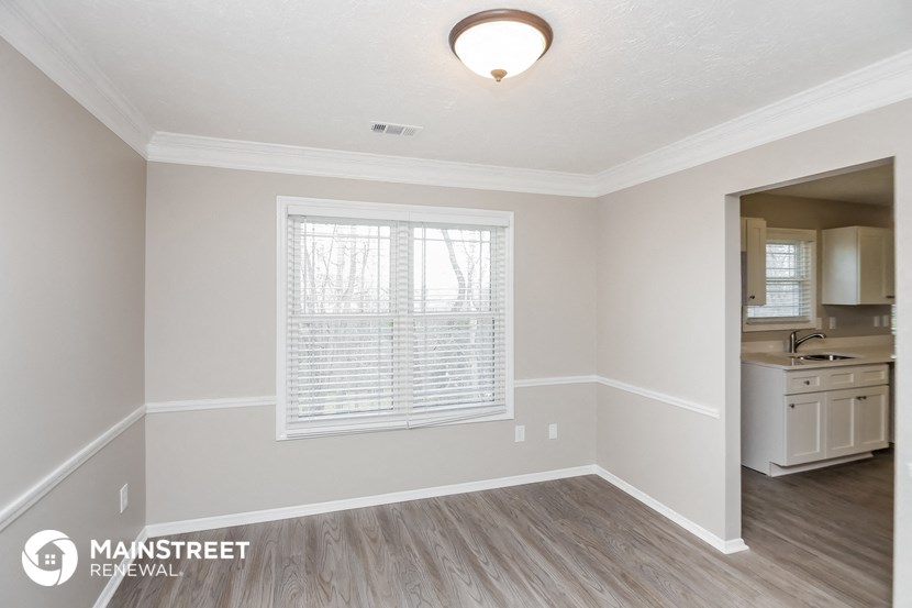 the kitchen and dining room of a renovated house