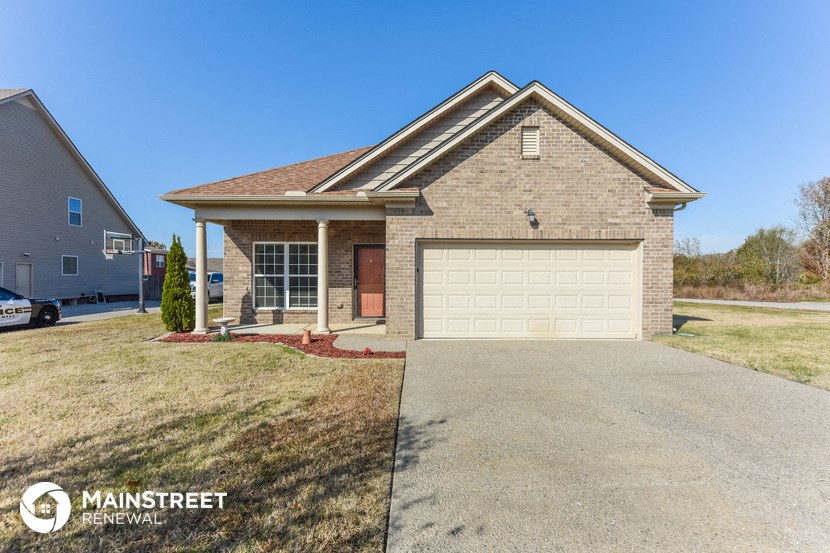 a brick house with a white garage door