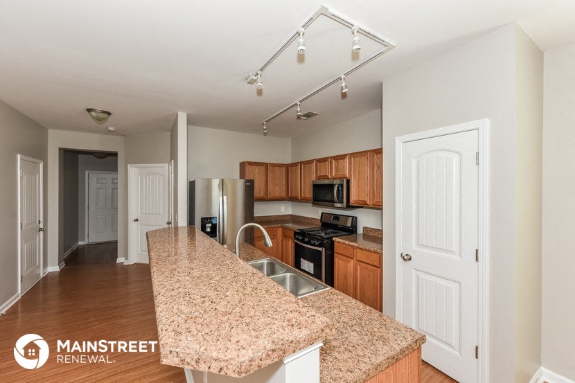 a kitchen with a granite counter top and a sink